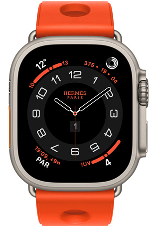 Apple Watch Hermès Ultra 3, esfera analógica Circulaire, (aguja horaria, minutero y segundero, complicaciones: Tiempo, anillos de Actividad, hora de París e Índice UV), caja de titanio, color natural, lateral derecho, Digital Crown, botón lateral elevado, con la correa Scub'H Diving, color Orange Néon (naranja brillante), fabricada en goma moldeada, aberturas circulares en el centro