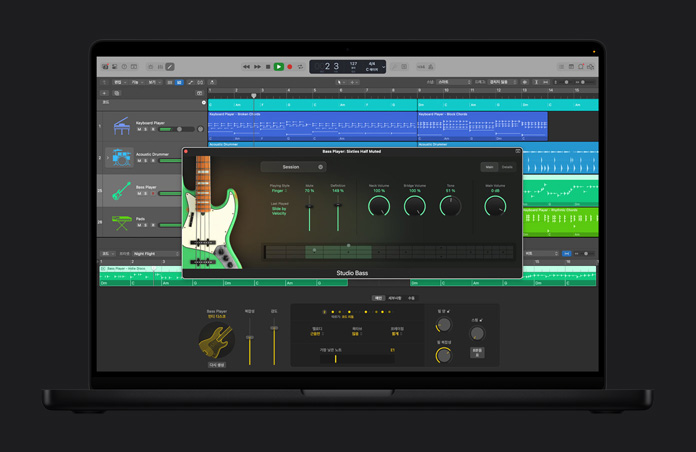 MacBook Pro 16 화면에 AI Session Player가 포함된 Logic Pro 인터페이스가 열려 있고, 다양한 볼륨 레벨을 보여주는 Bass Player: Sixties Half Muted 윈도우가 열려 있는 모습