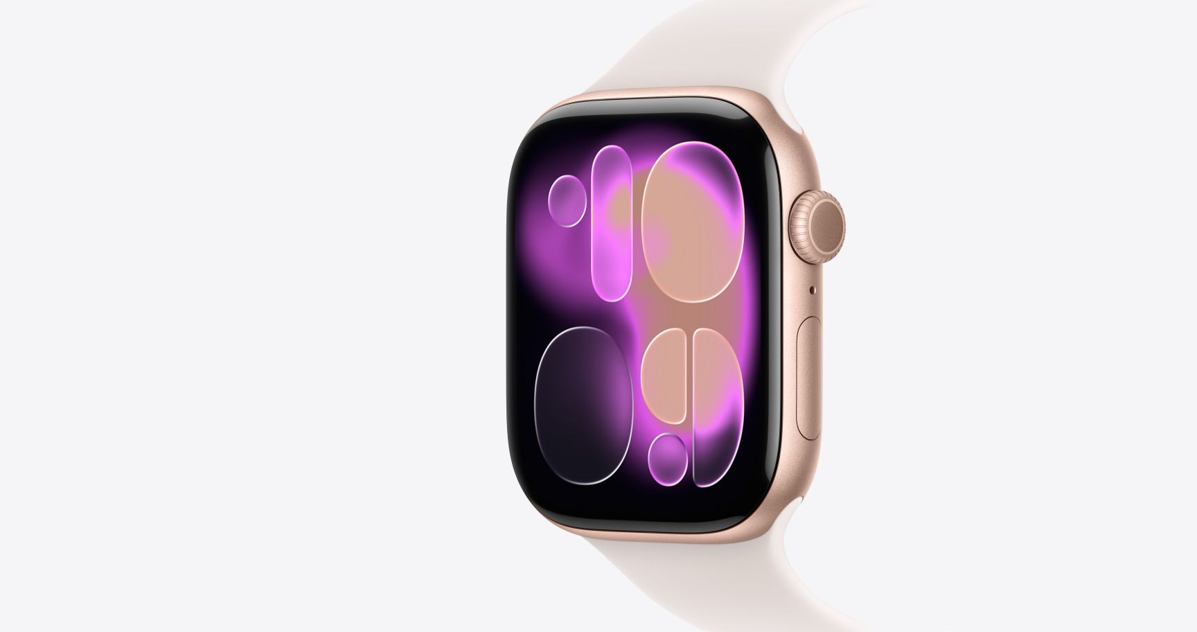Apple Watch Series 11, цвят розово златно, алуминиев корпус, Responsive Art циферблат, екстериор от дясната страна, Digital Crown, микрофон, страничен бутон, каишка Sport Band в цвят лек руж