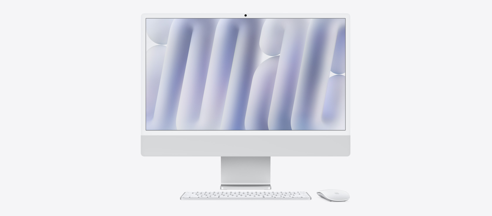 Front view of a silver iMac with colour-matching mouse and keyboard
