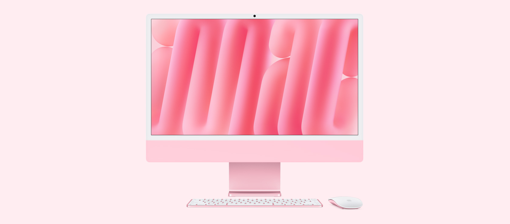 同じカラーのマウスとキーボードを合わせたピンクのiMacを正面から見た図