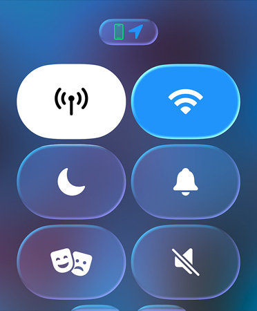 Translucent Control Center icons, including Do Not Disturb and Theater Mode, refract the blurred background